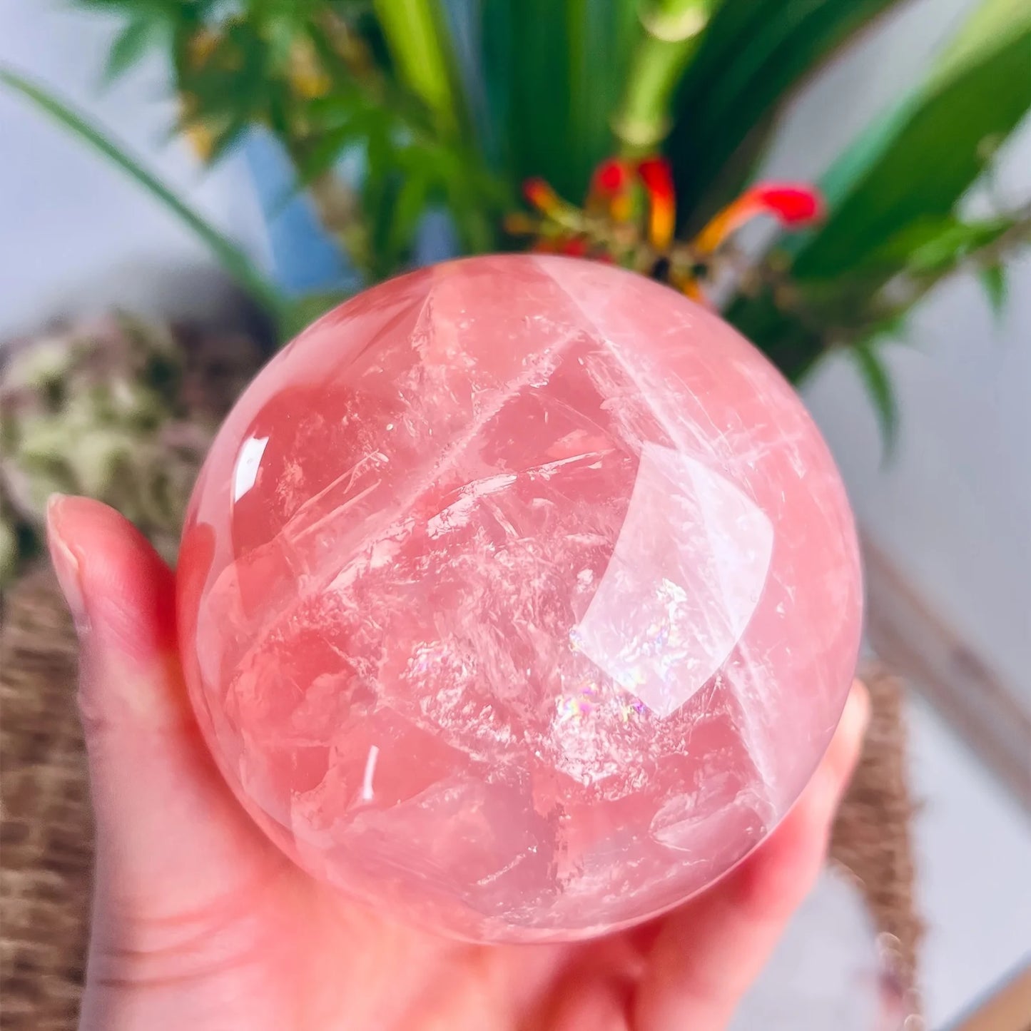 A large rose quartz crystal ball - a deep pink bohemian sphere, perfect for weddings and Valentine's Day decorations.