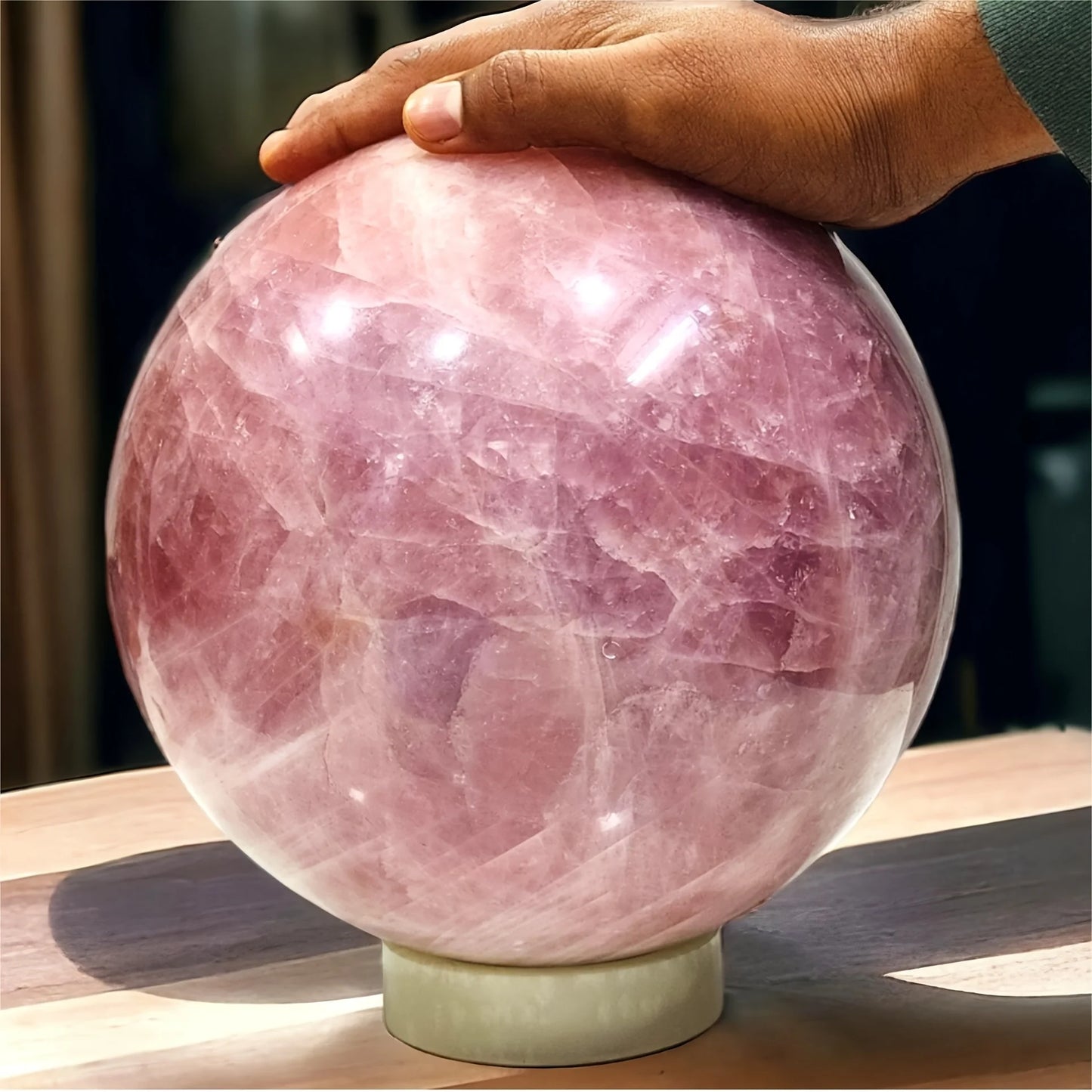 A large rose quartz crystal ball - a deep pink bohemian sphere, perfect for weddings and Valentine's Day decorations.